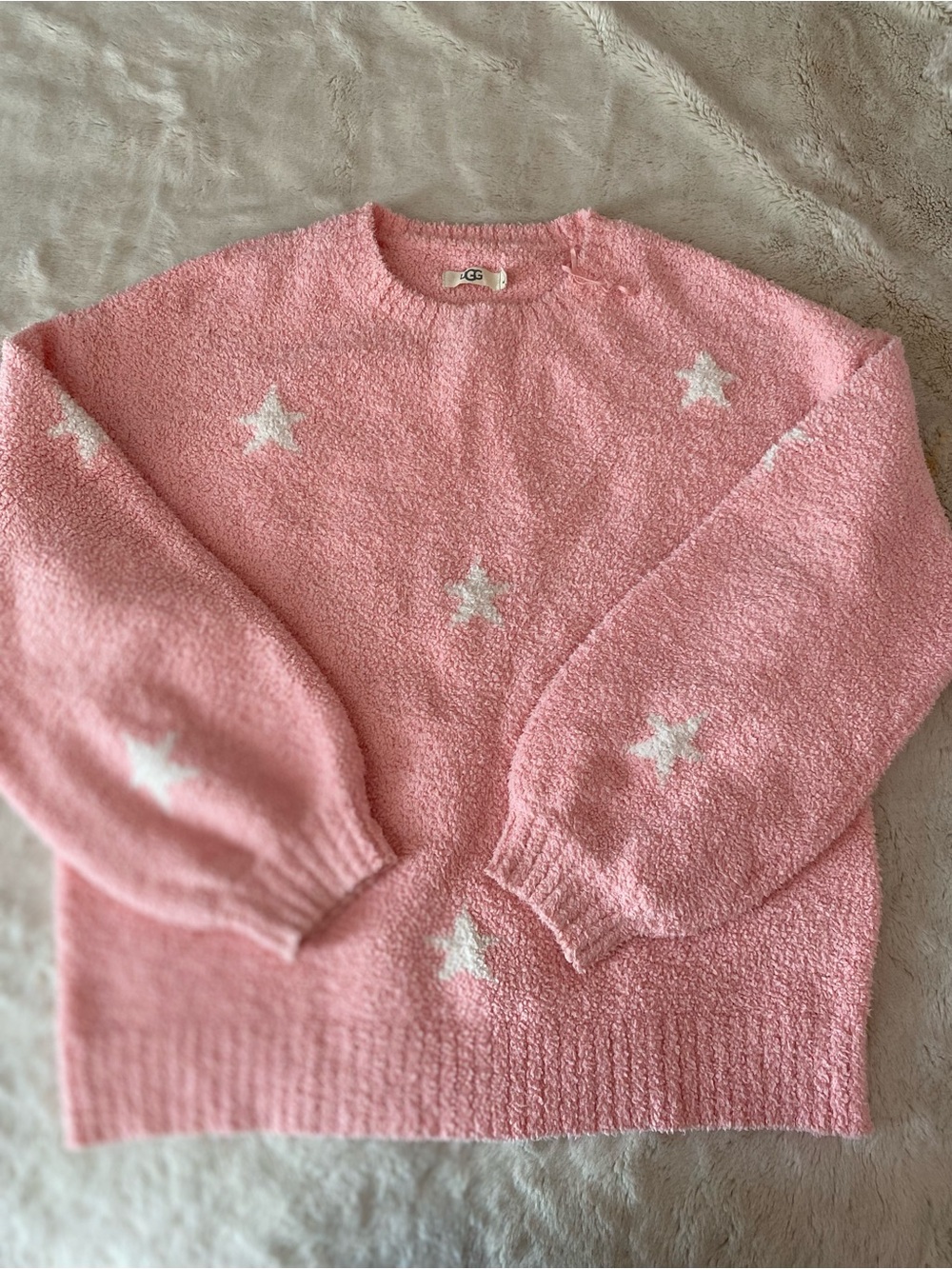 UGG women’s pink soft, fluffy knit sweater with white stars print